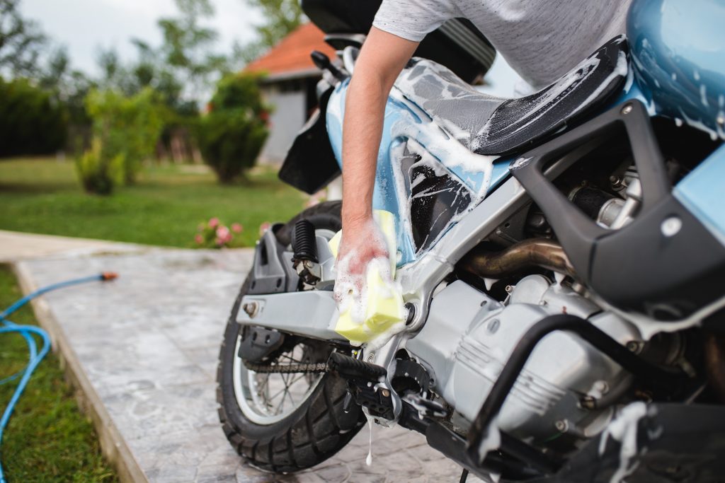 A motorcycle being washed 