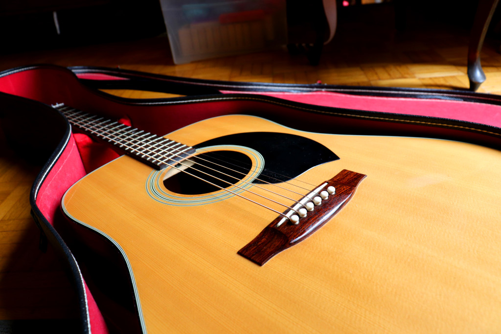 Acoustic guitar in a hard case 