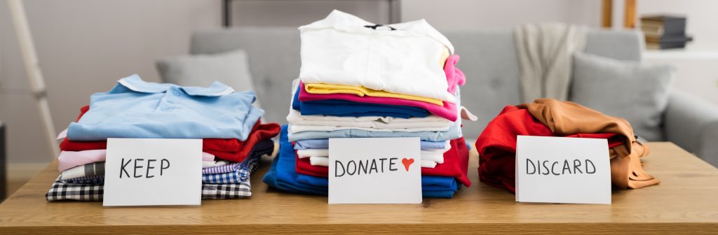 Keep, donate, and discard clothing piles