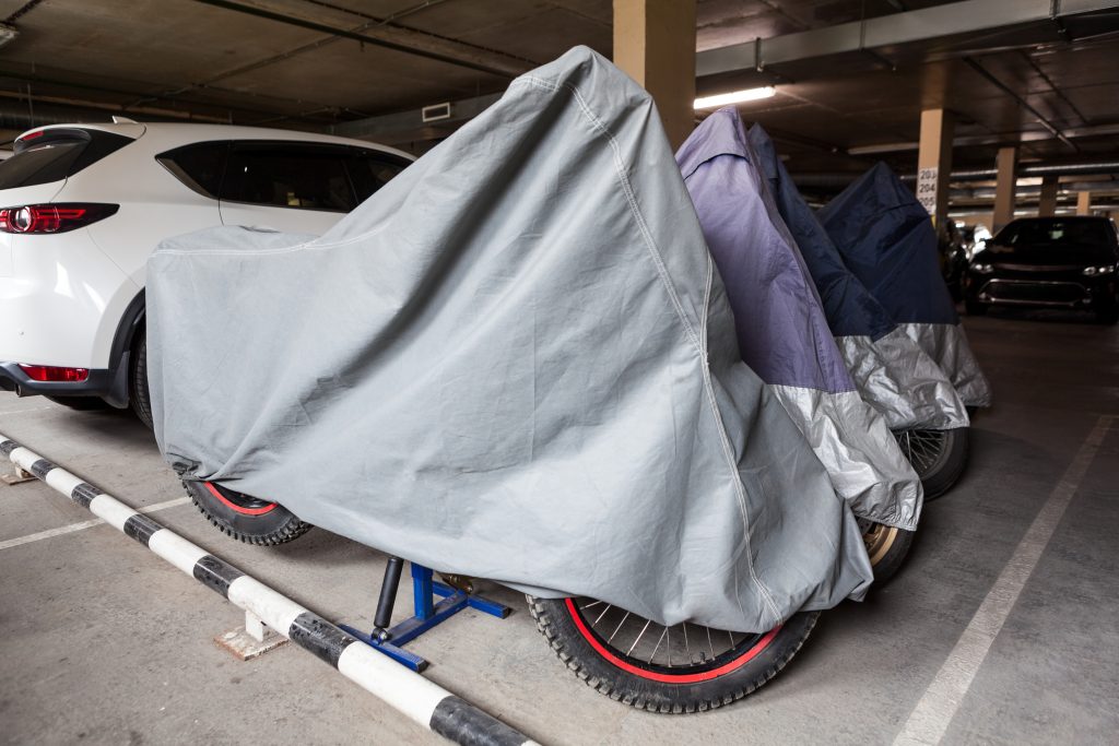 Motorcycle covered in a parking garage