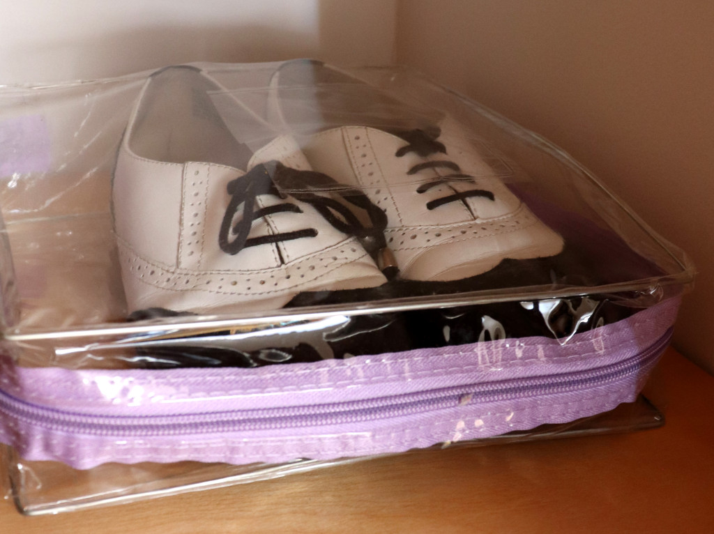 Storing shoes in a dust cover 