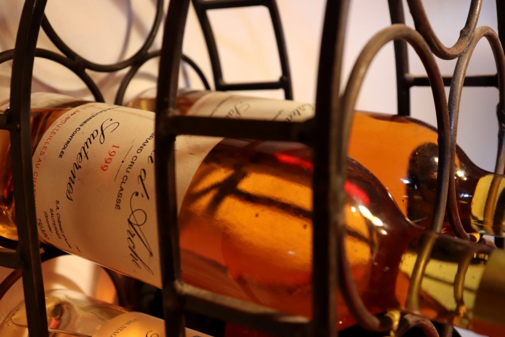 White wine stored on its side on a wine storage rack 