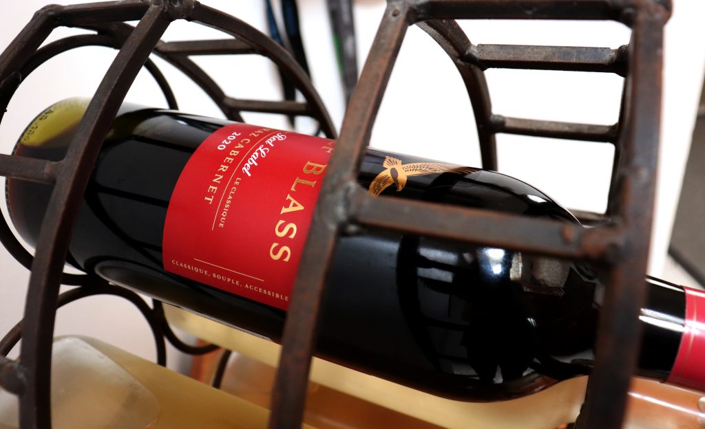 Red wine stored on dedicated wine storage rack 