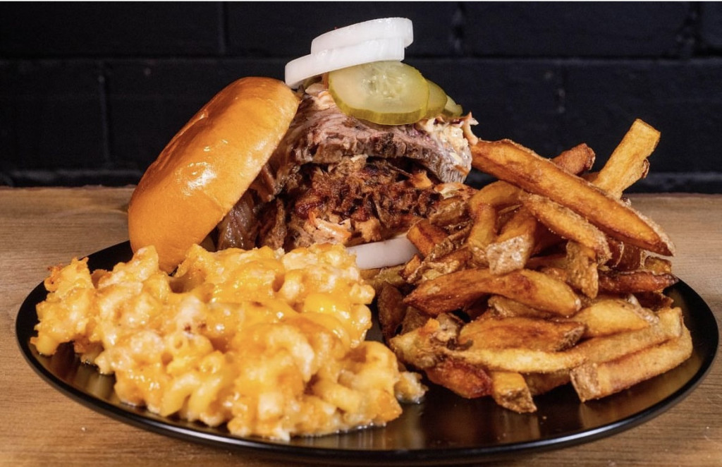 Pork sandwich with French fries and mac and cheese