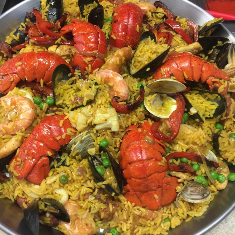 Seafood dish with lobsters, shrimp, clams and rice