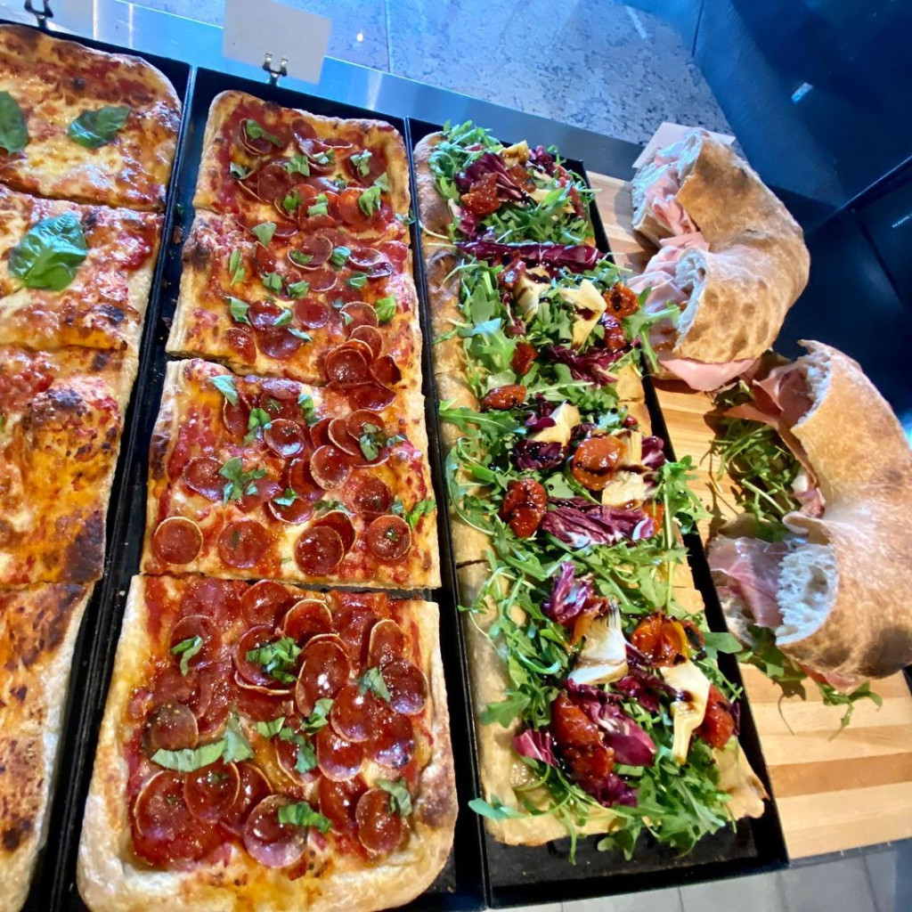 Assortment of pizzas and sandwiches from Capi's Pizza