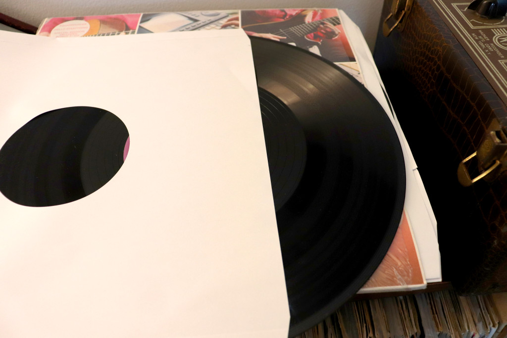 A vinyl record in a protective paper sleeve