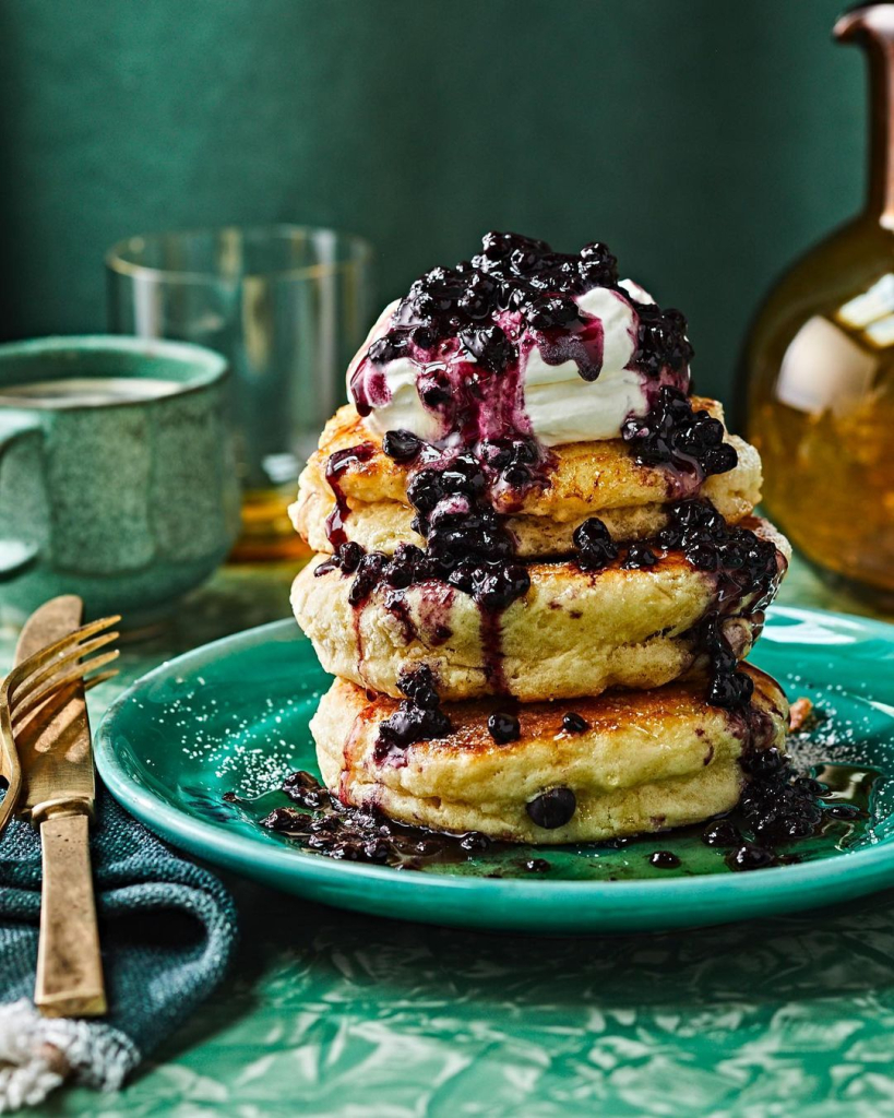Buttermilk pancakes with blueberries and whipped cream
