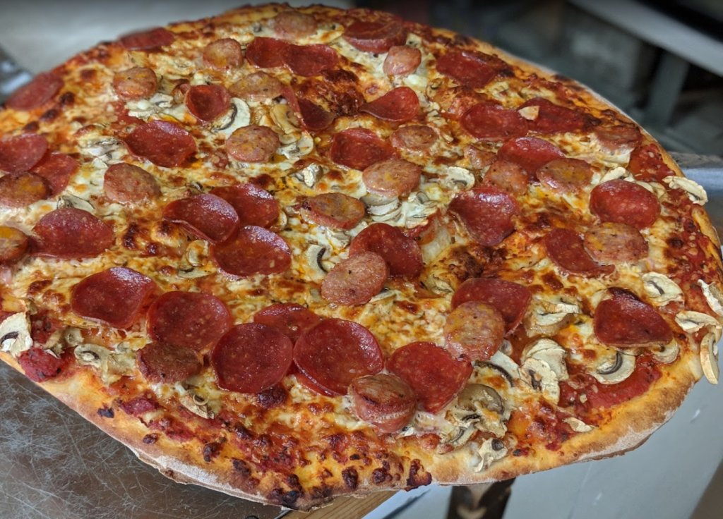 Pepperoni, sausage, and mushroom pizza